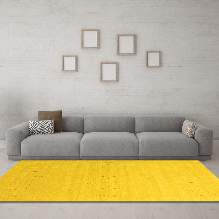 Machine Washable Solid Yellow Modern Rug in a Living Room, wshcon2500yw