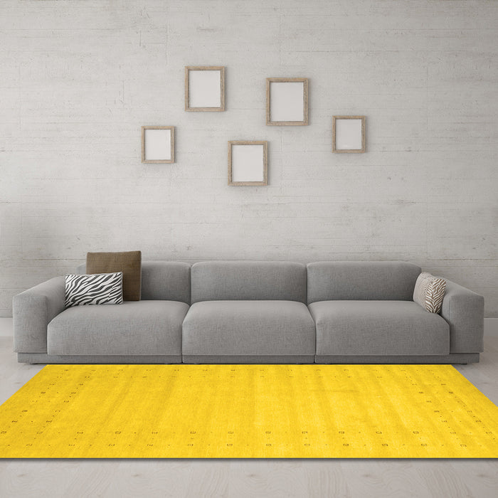 Machine Washable Solid Yellow Modern Rug in a Living Room, wshcon2502yw