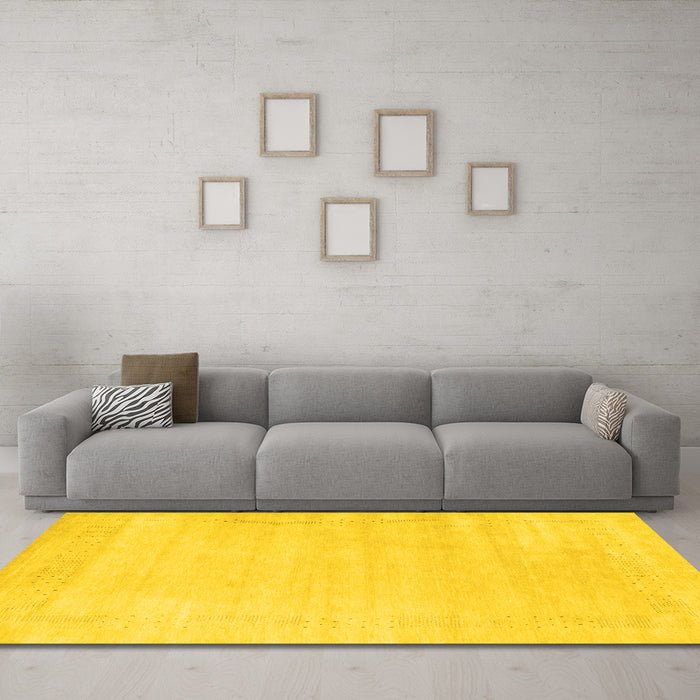 Machine Washable Solid Yellow Modern Rug in a Living Room, wshcon2509yw
