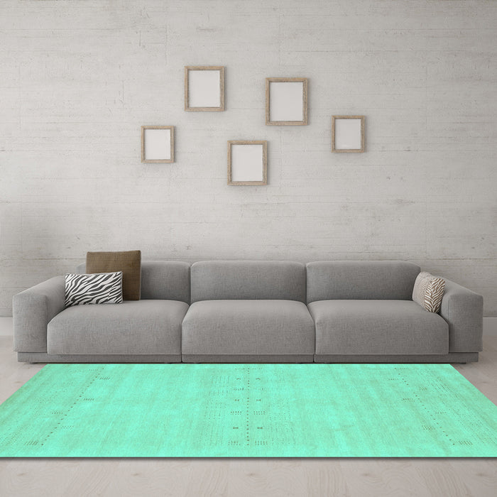 Machine Washable Solid Turquoise Modern Area Rugs in a Living Room,, wshcon2510turq