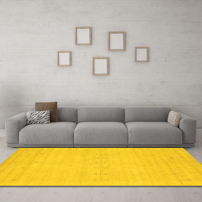 Machine Washable Solid Yellow Modern Rug in a Living Room, wshcon2510yw
