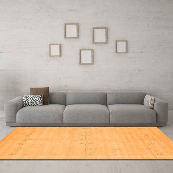 Machine Washable Solid Orange Modern Area Rugs in a Living Room, wshcon2510org