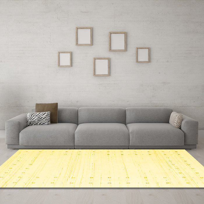 Machine Washable Solid Yellow Modern Rug in a Living Room, wshcon2511yw