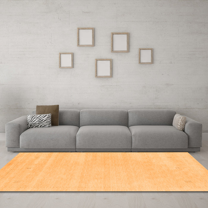 Machine Washable Solid Orange Modern Area Rugs in a Living Room, wshcon2516org