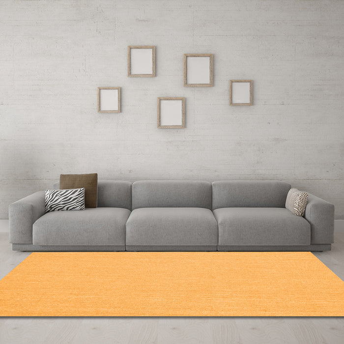 Machine Washable Solid Orange Modern Area Rugs in a Living Room, wshcon251org