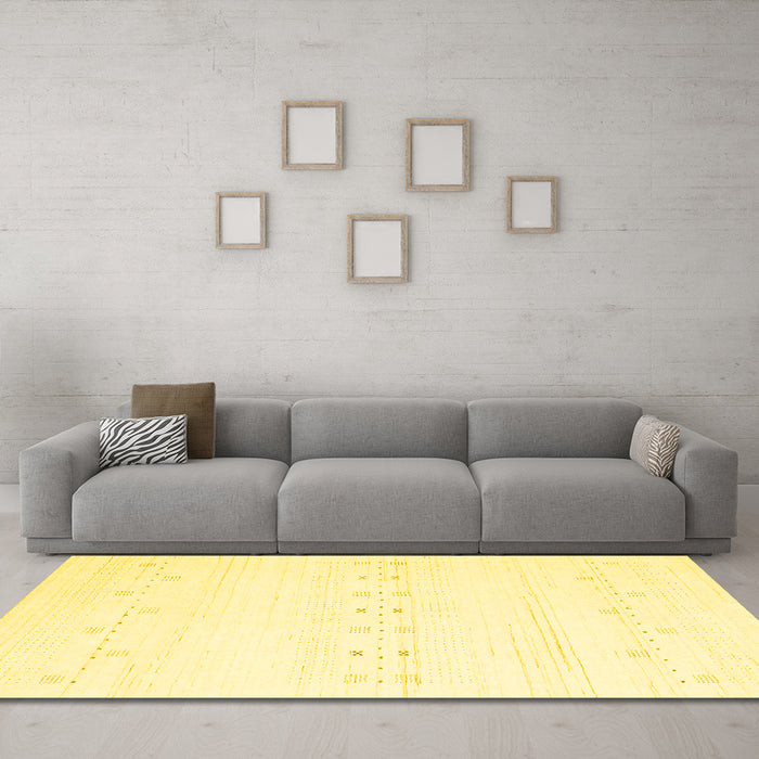 Machine Washable Solid Yellow Modern Rug in a Living Room, wshcon2521yw