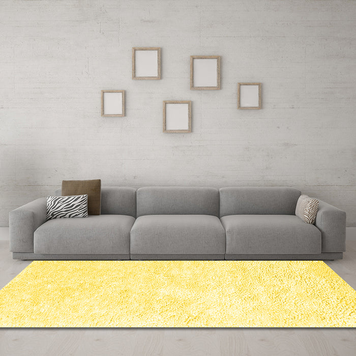 Machine Washable Solid Yellow Modern Rug in a Living Room, wshcon2561yw