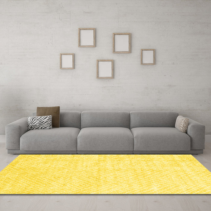 Machine Washable Solid Yellow Modern Rug in a Living Room, wshcon2565yw