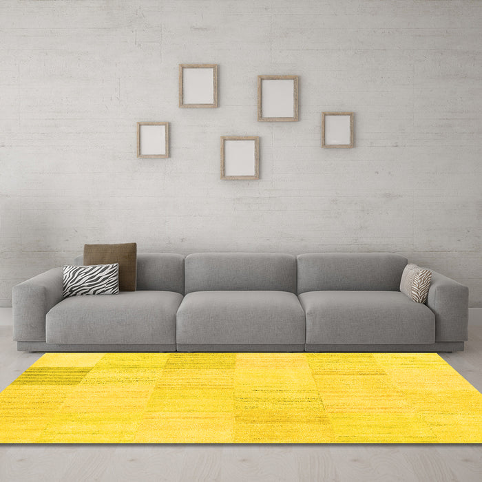 Machine Washable Solid Yellow Modern Rug in a Living Room, wshcon2597yw