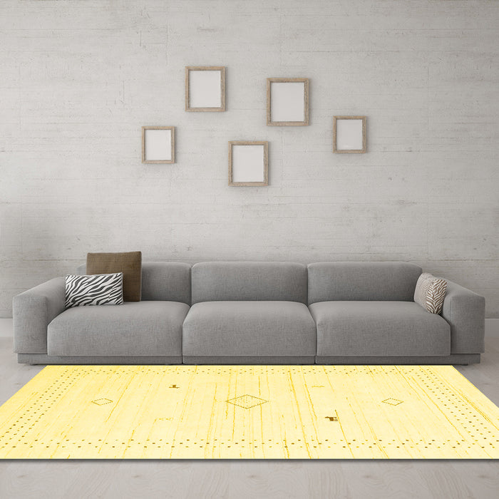 Machine Washable Solid Yellow Modern Rug in a Living Room, wshcon2611yw