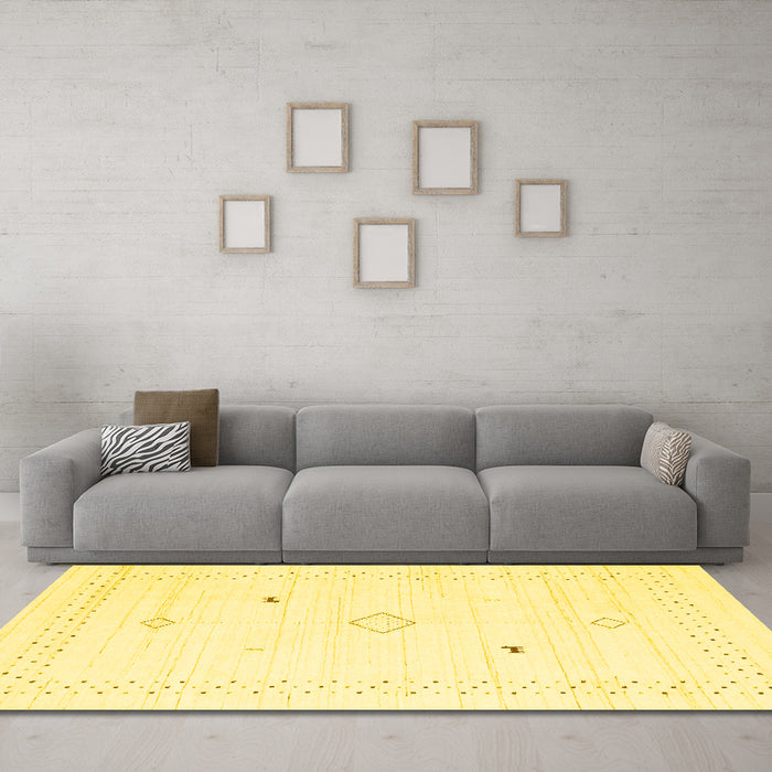 Machine Washable Solid Yellow Modern Rug in a Living Room, wshcon2617yw