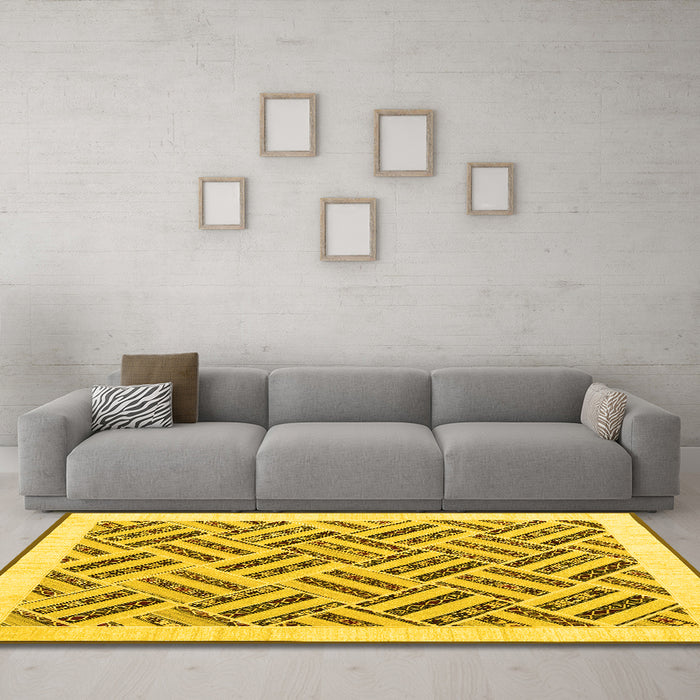 Machine Washable Solid Yellow Modern Rug in a Living Room, wshcon2634yw