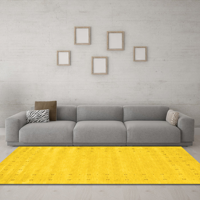 Machine Washable Solid Yellow Modern Rug in a Living Room, wshcon2650yw