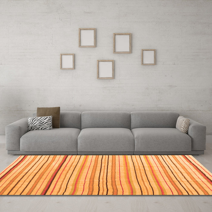 Machine Washable Solid Orange Modern Area Rugs in a Living Room, wshcon2679org