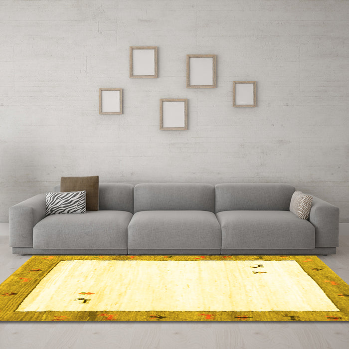 Machine Washable Solid Yellow Modern Rug in a Living Room, wshcon2708yw