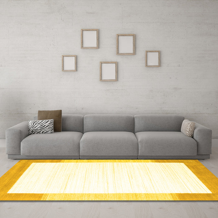 Machine Washable Solid Yellow Modern Rug in a Living Room, wshcon270yw