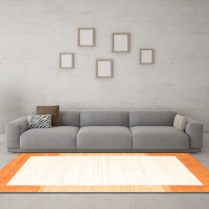 Machine Washable Solid Orange Modern Area Rugs in a Living Room, wshcon270org