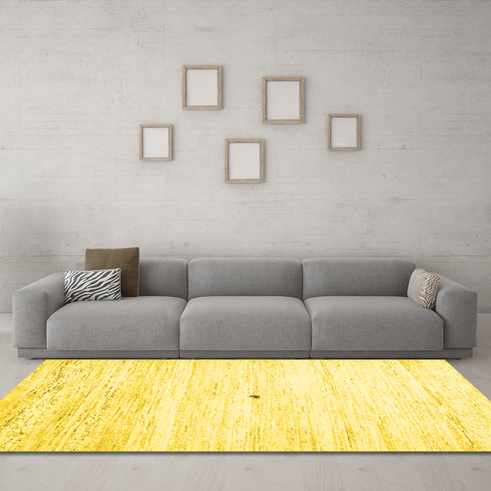 Machine Washable Solid Yellow Modern Rug in a Living Room, wshcon2719yw