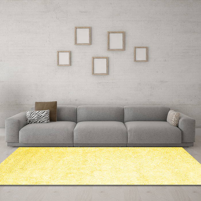 Machine Washable Solid Yellow Modern Rug in a Living Room, wshcon2737yw