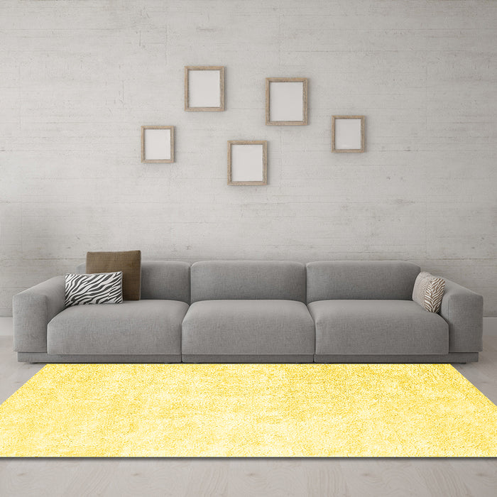 Machine Washable Solid Yellow Modern Rug in a Living Room, wshcon2748yw