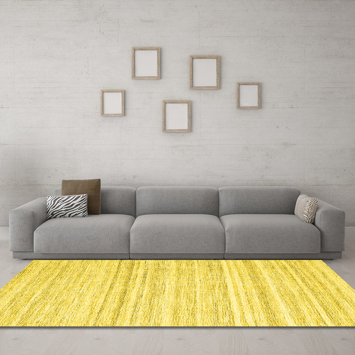 Machine Washable Solid Yellow Modern Rug in a Living Room, wshcon2769yw