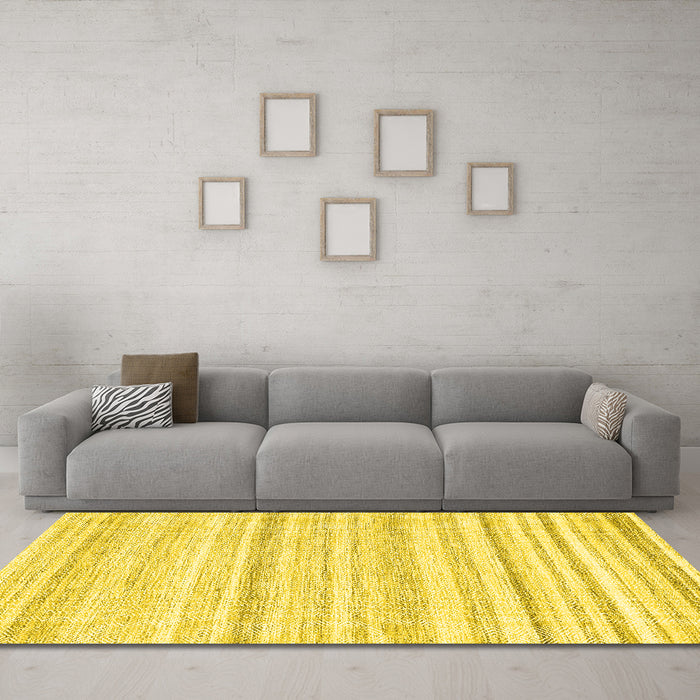 Machine Washable Solid Yellow Modern Rug in a Living Room, wshcon2781yw