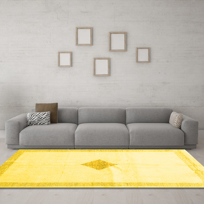 Machine Washable Solid Yellow Modern Rug in a Living Room, wshcon2891yw