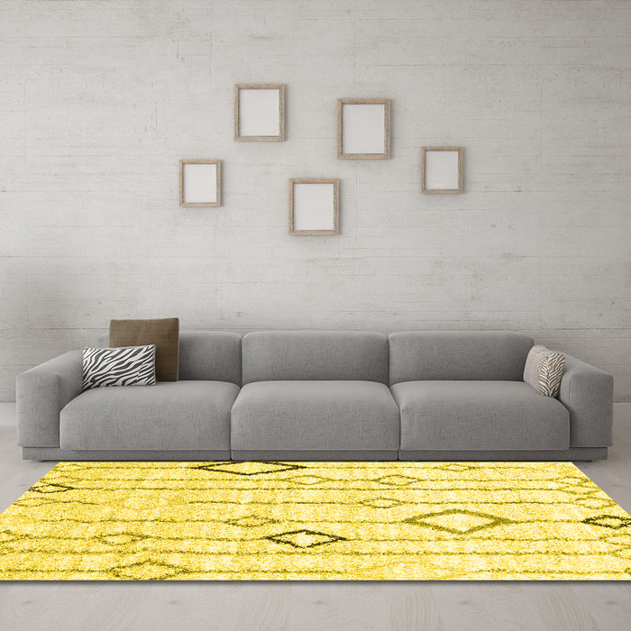 Machine Washable Solid Yellow Modern Rug in a Living Room, wshcon3034yw