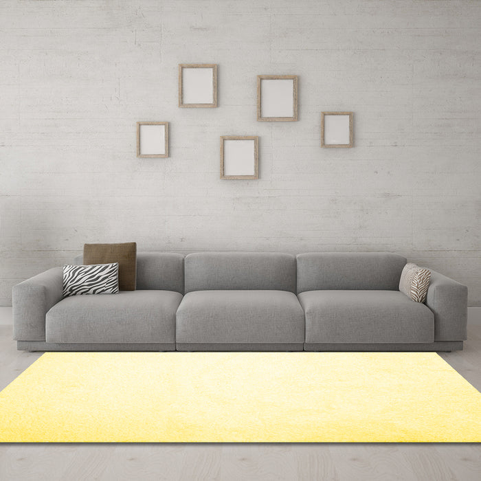 Machine Washable Solid Yellow Modern Rug in a Living Room, wshcon422yw