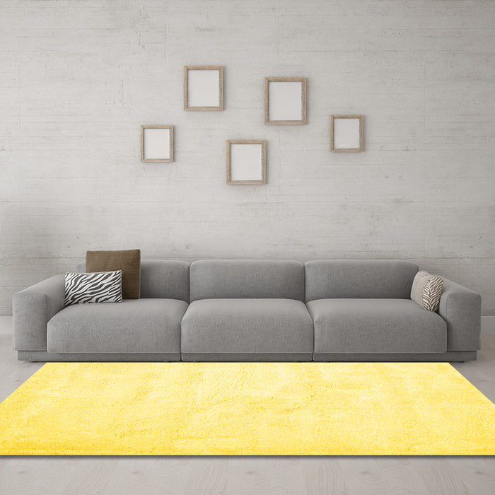 Machine Washable Solid Yellow Modern Rug in a Living Room, wshcon424yw