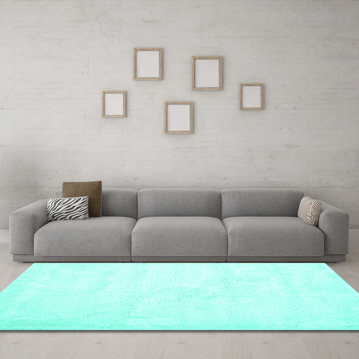 Machine Washable Solid Turquoise Modern Area Rugs in a Living Room,, wshcon424turq