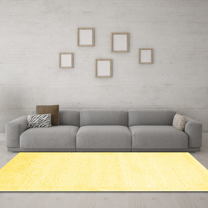 Machine Washable Solid Yellow Modern Rug in a Living Room, wshcon476yw