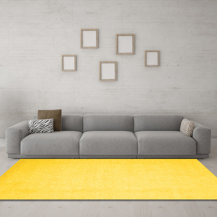 Machine Washable Solid Yellow Modern Rug in a Living Room, wshcon511yw