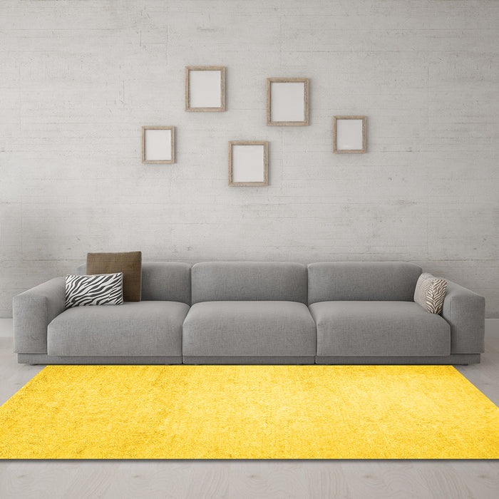 Machine Washable Solid Yellow Modern Rug in a Living Room, wshcon521yw