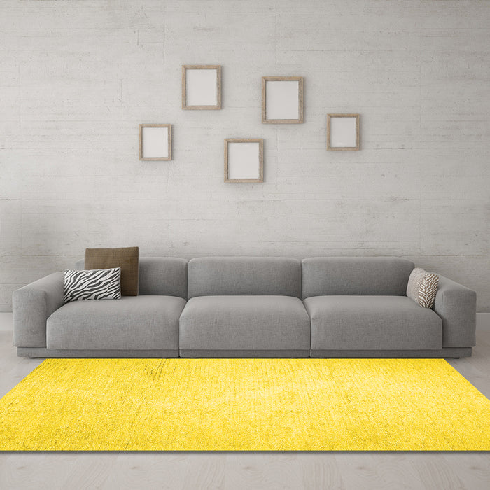 Machine Washable Solid Yellow Modern Rug in a Living Room, wshcon523yw