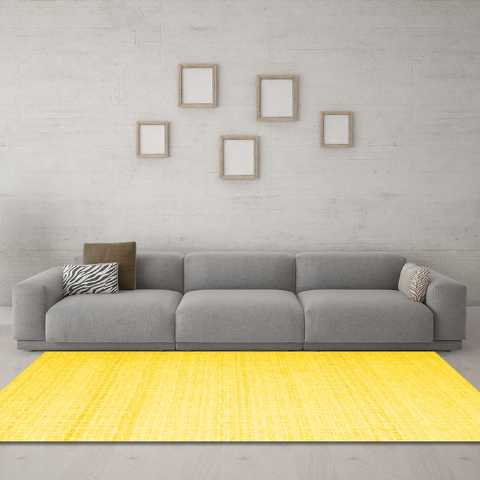 Machine Washable Solid Yellow Modern Rug in a Living Room, wshcon533yw