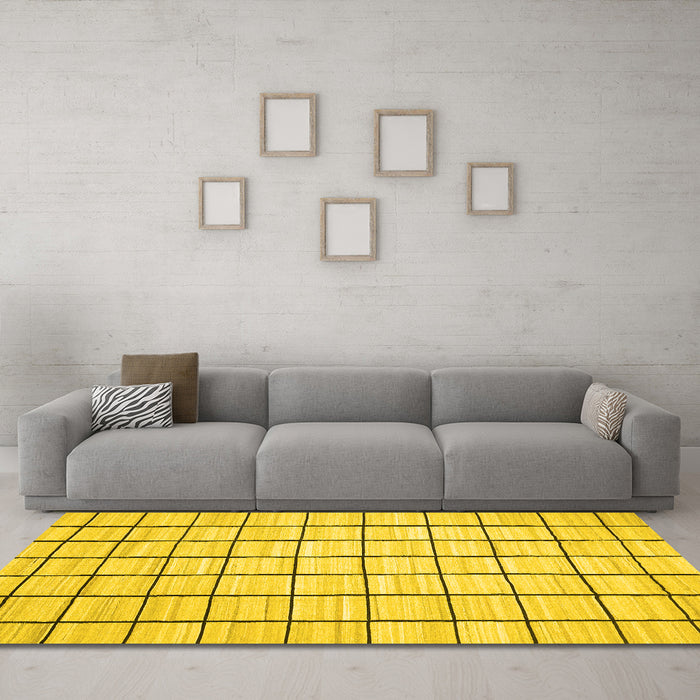 Machine Washable Solid Yellow Modern Rug in a Living Room, wshcon552yw