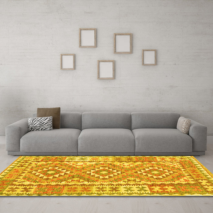 Machine Washable Oriental Yellow Traditional Rug in a Living Room, wshcon553yw