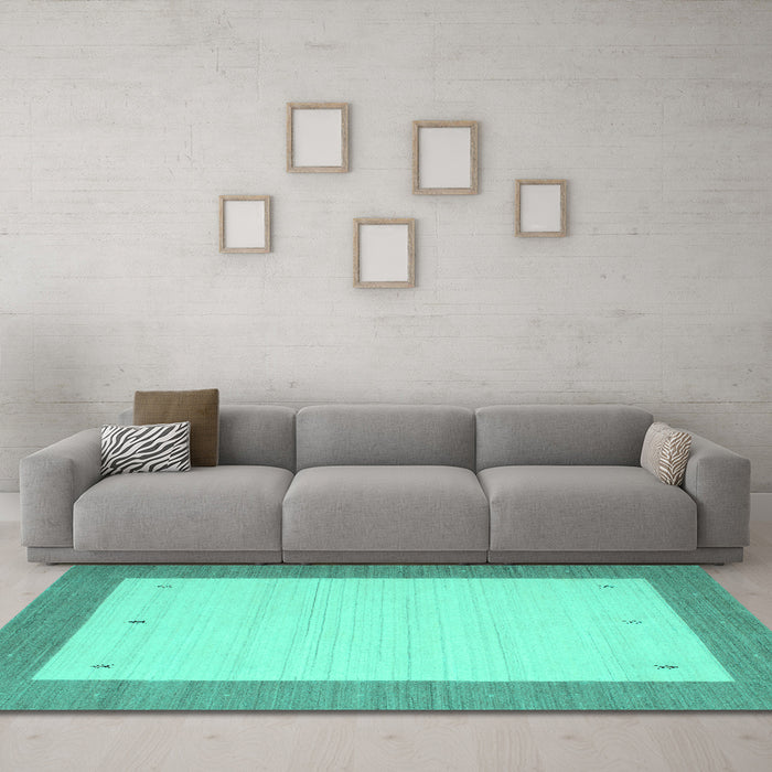 Machine Washable Solid Turquoise Modern Area Rugs in a Living Room,, wshcon568turq