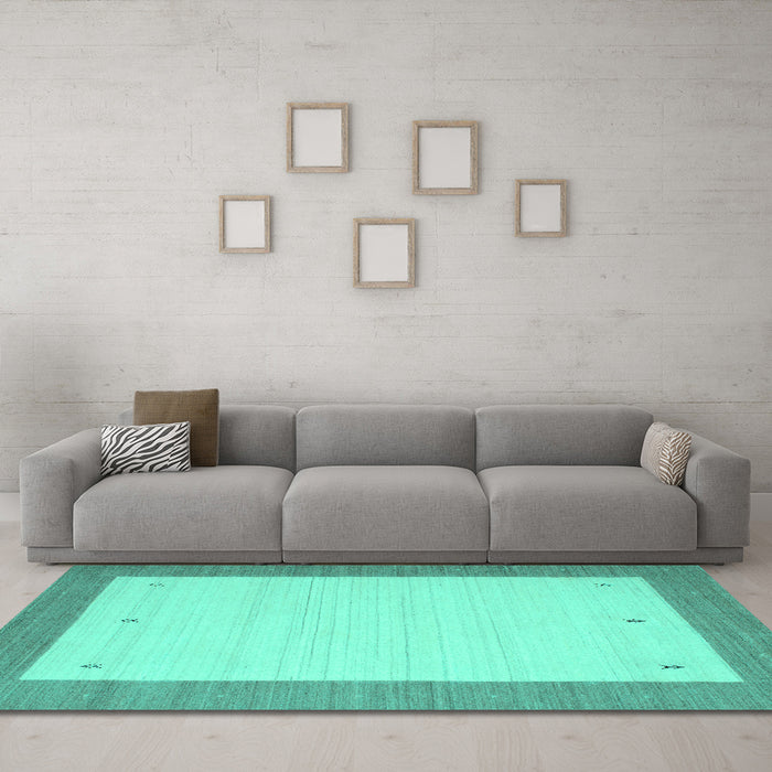 Machine Washable Solid Turquoise Modern Area Rugs in a Living Room,, wshcon569turq
