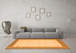 Machine Washable Solid Orange Modern Area Rugs in a Living Room, wshcon569org