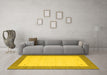 Machine Washable Solid Yellow Modern Rug in a Living Room, wshcon569yw