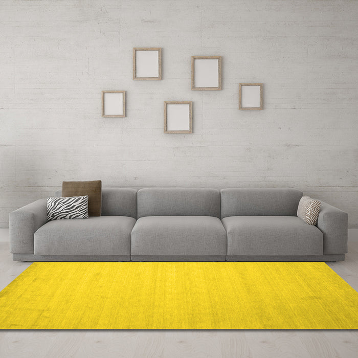Machine Washable Solid Yellow Modern Rug in a Living Room, wshcon579yw