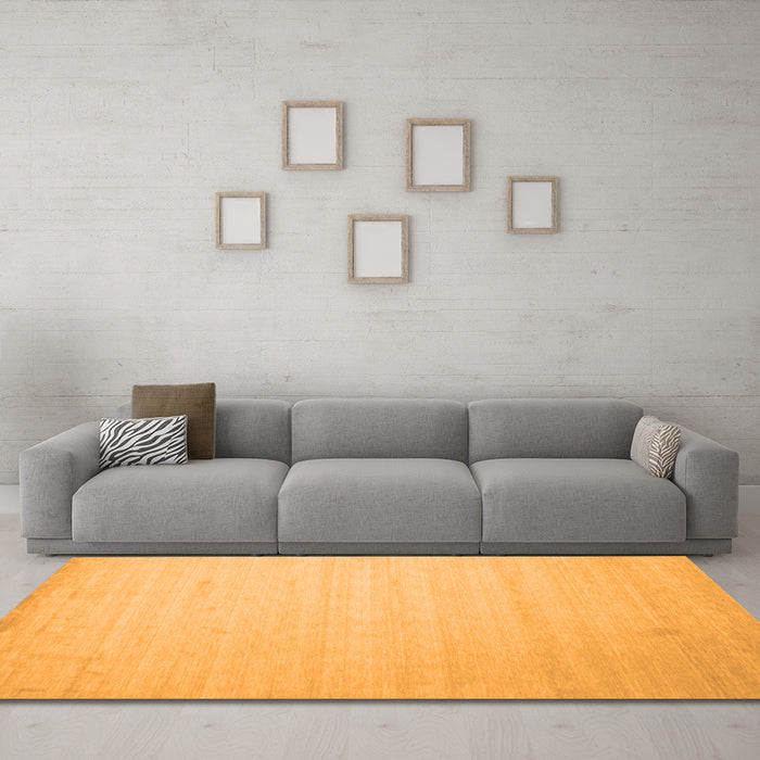Machine Washable Solid Orange Modern Area Rugs in a Living Room, wshcon579org