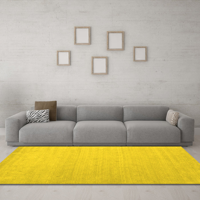 Machine Washable Solid Yellow Modern Rug in a Living Room, wshcon580yw