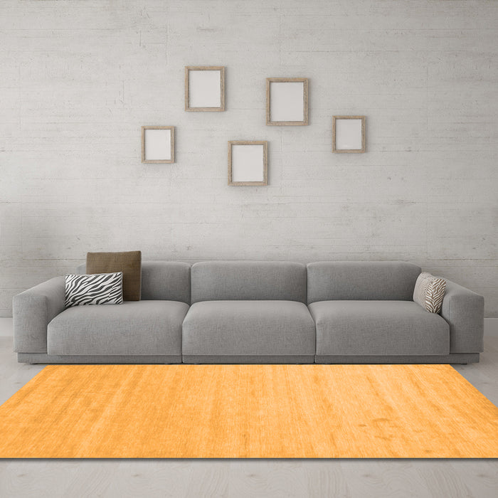 Machine Washable Solid Orange Modern Area Rugs in a Living Room, wshcon582org