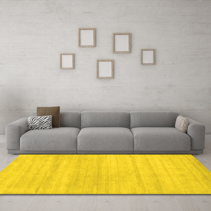 Machine Washable Solid Yellow Modern Rug in a Living Room, wshcon586yw