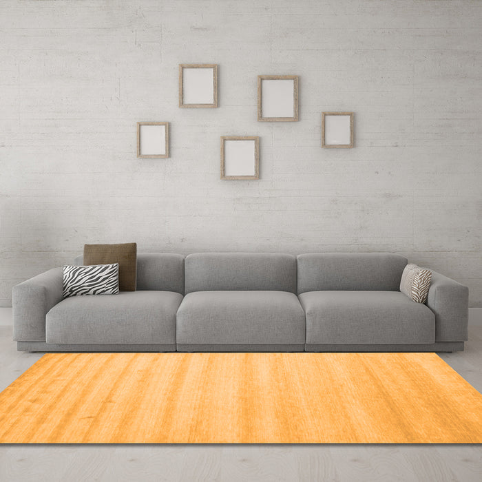 Machine Washable Solid Orange Modern Area Rugs in a Living Room, wshcon590org