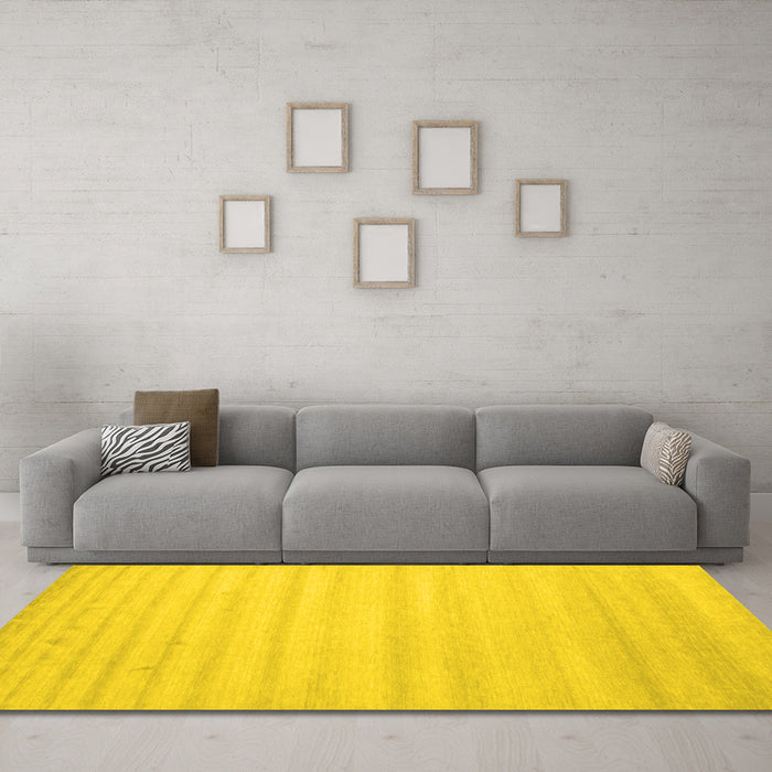 Machine Washable Solid Yellow Modern Rug in a Living Room, wshcon590yw
