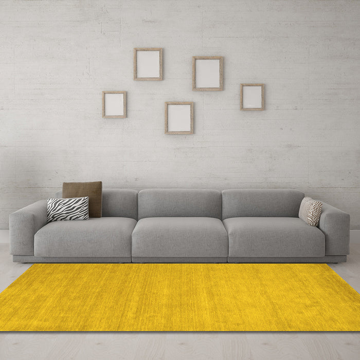 Machine Washable Solid Yellow Modern Rug in a Living Room, wshcon62yw